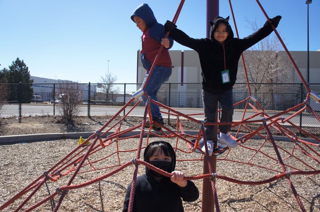Group of students posing on the playground