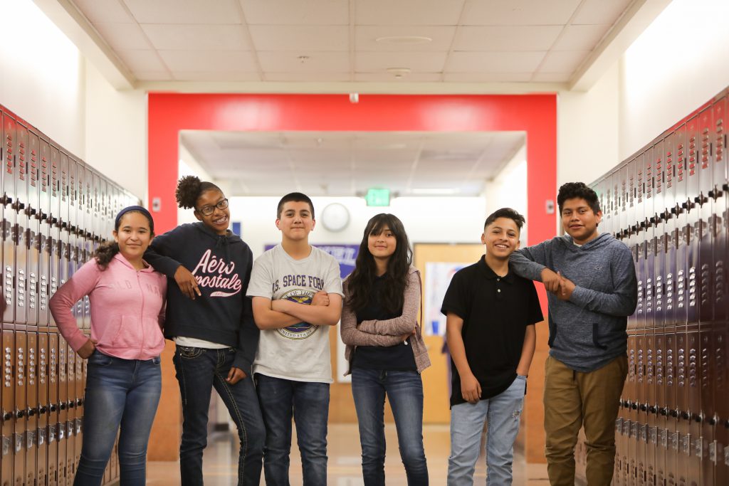 Group of students posing in the halls