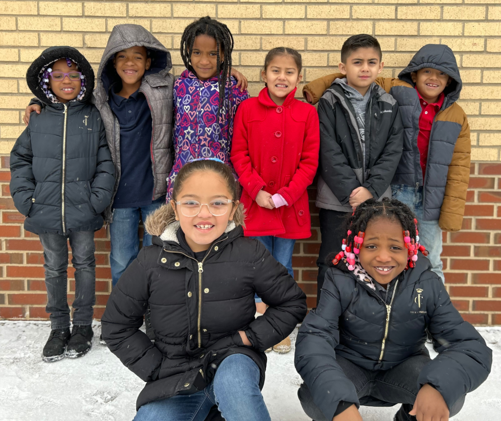 Group of students posing outside in the snow